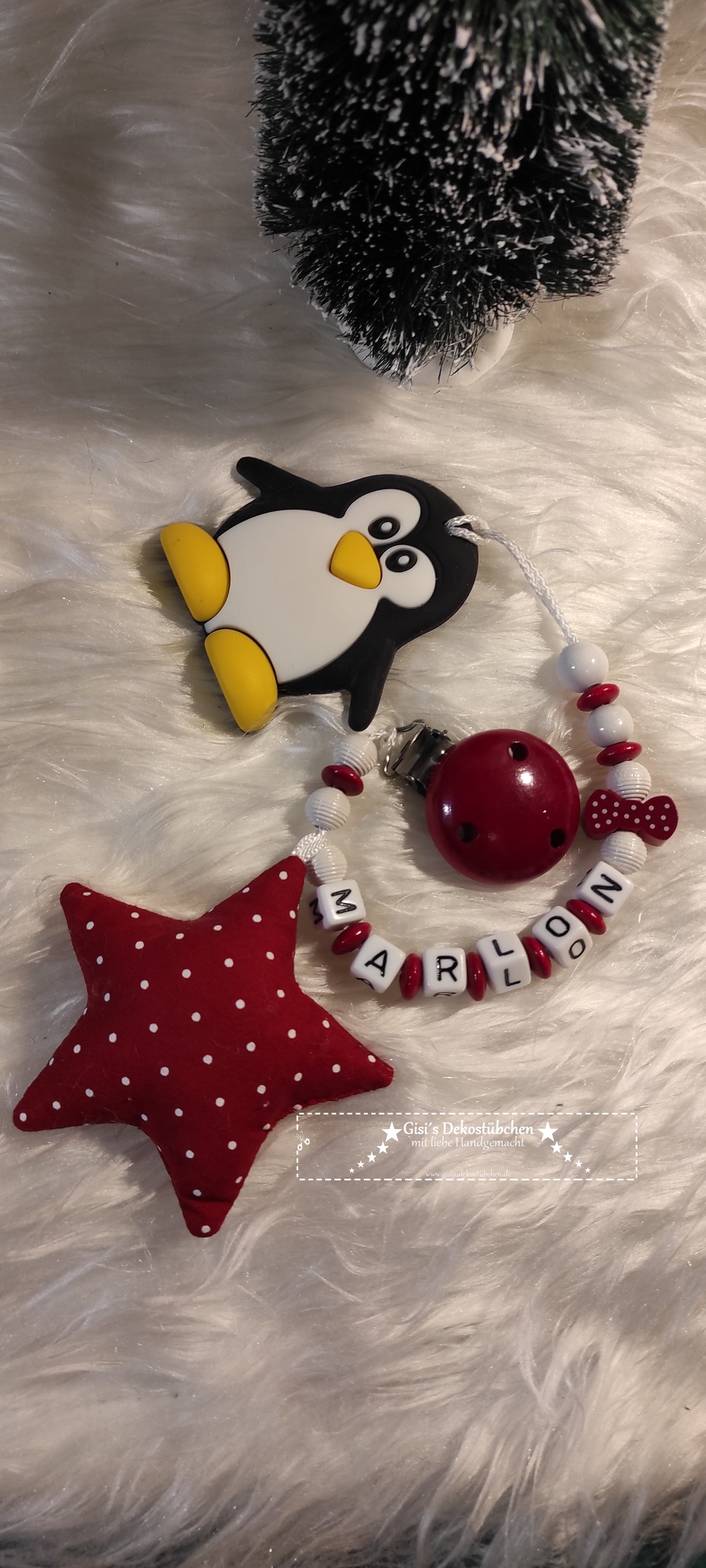 Teething necklace made of wood, silicone penguin, red materials