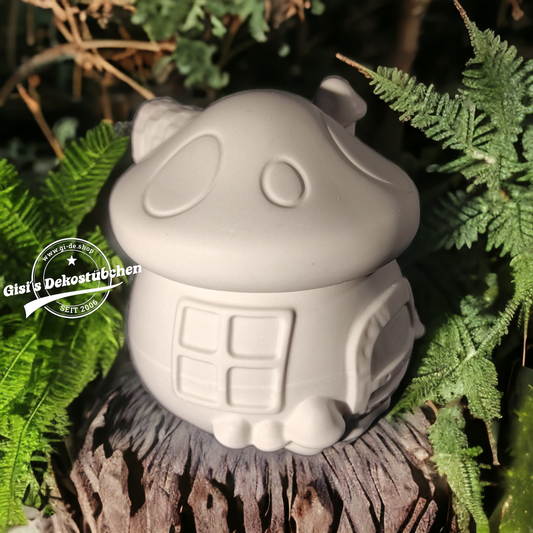 Cute ceramic mushroom in the shape of a box with a door and chimney.