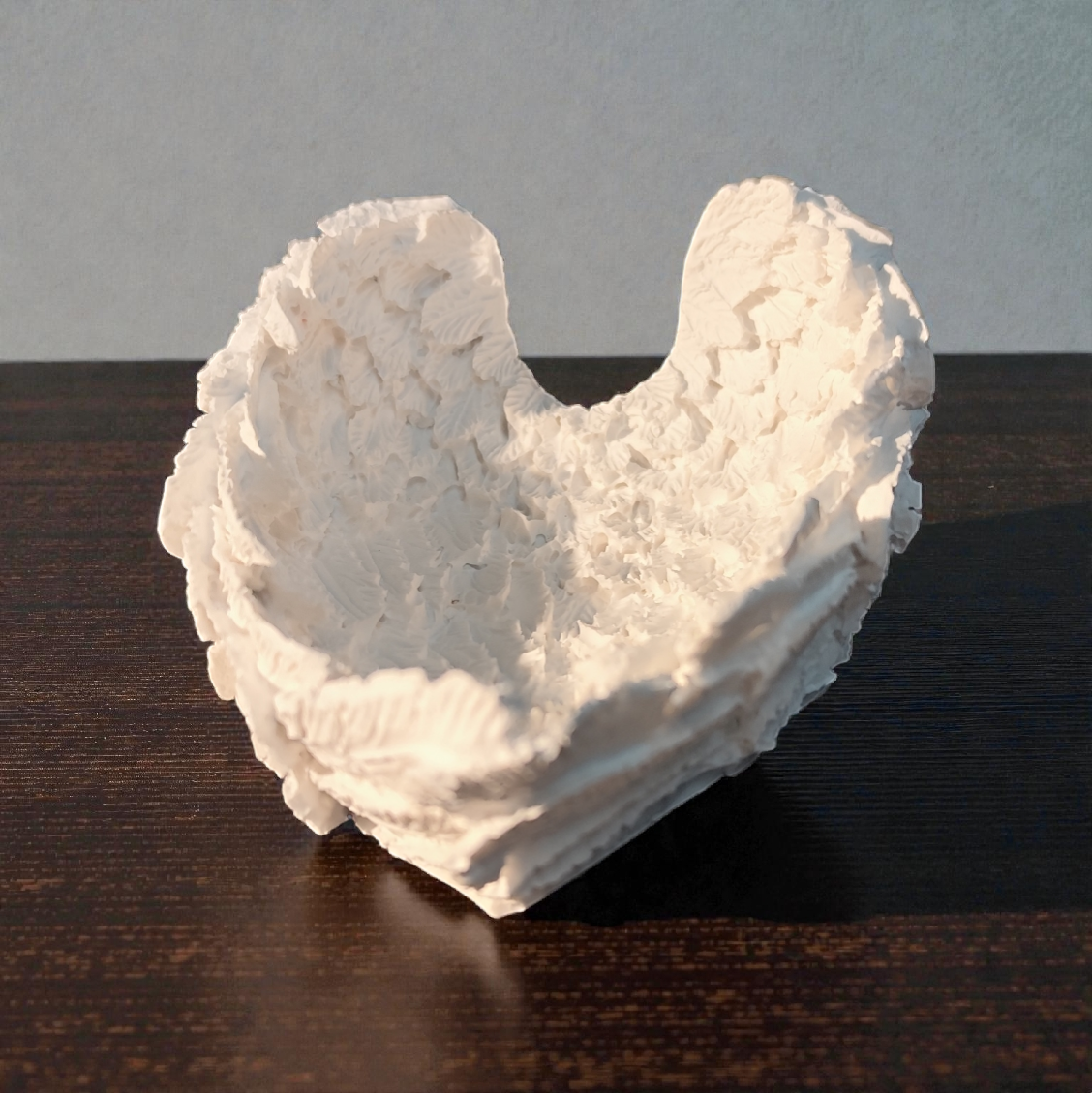 Ceramic wings used as a bowl or storage container