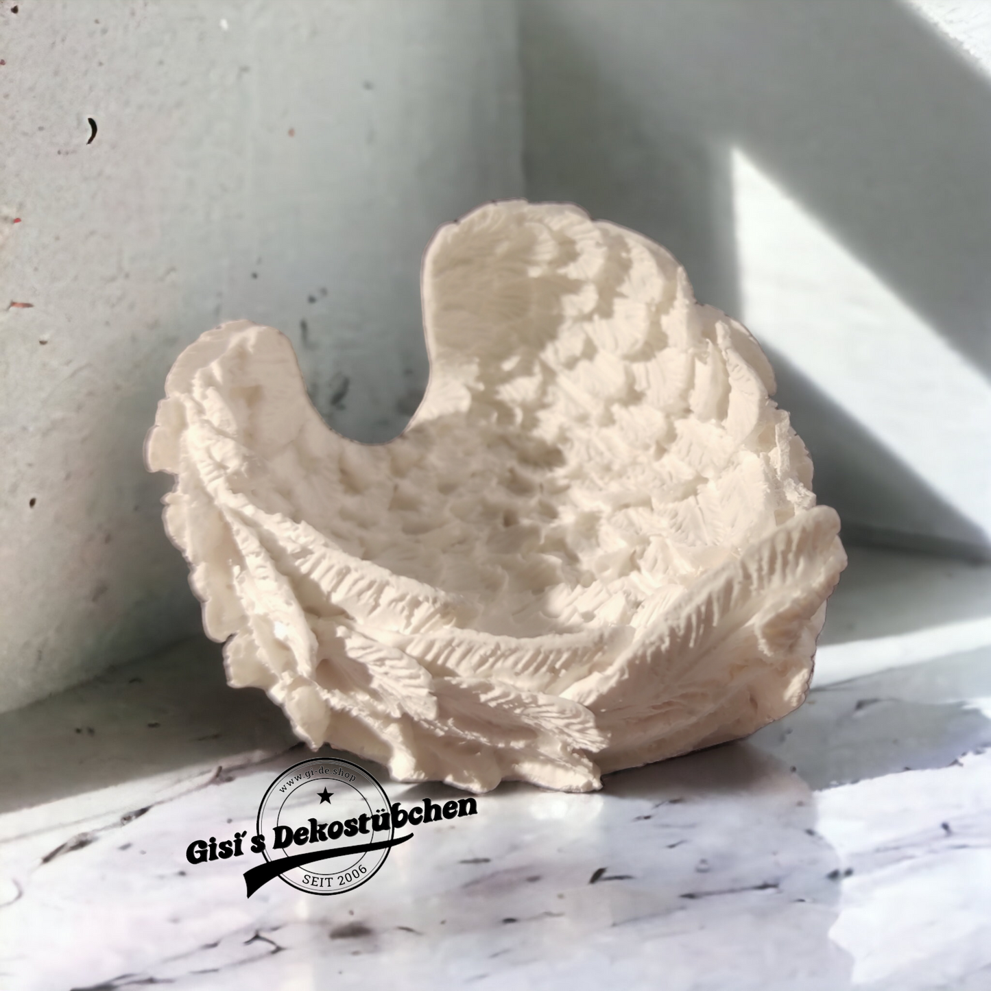 Ceramic wings used as a bowl or storage container