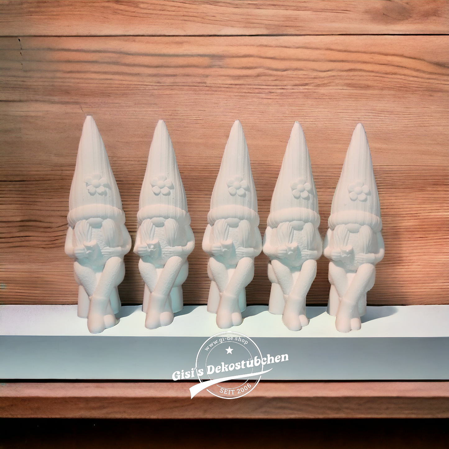 Ceramic gnome no. 4 sitting with cup and flower