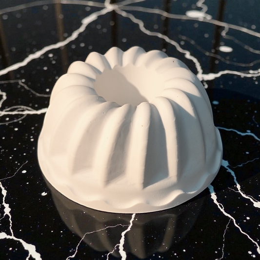 Mini Bundt cake, candle holder, slice of cake