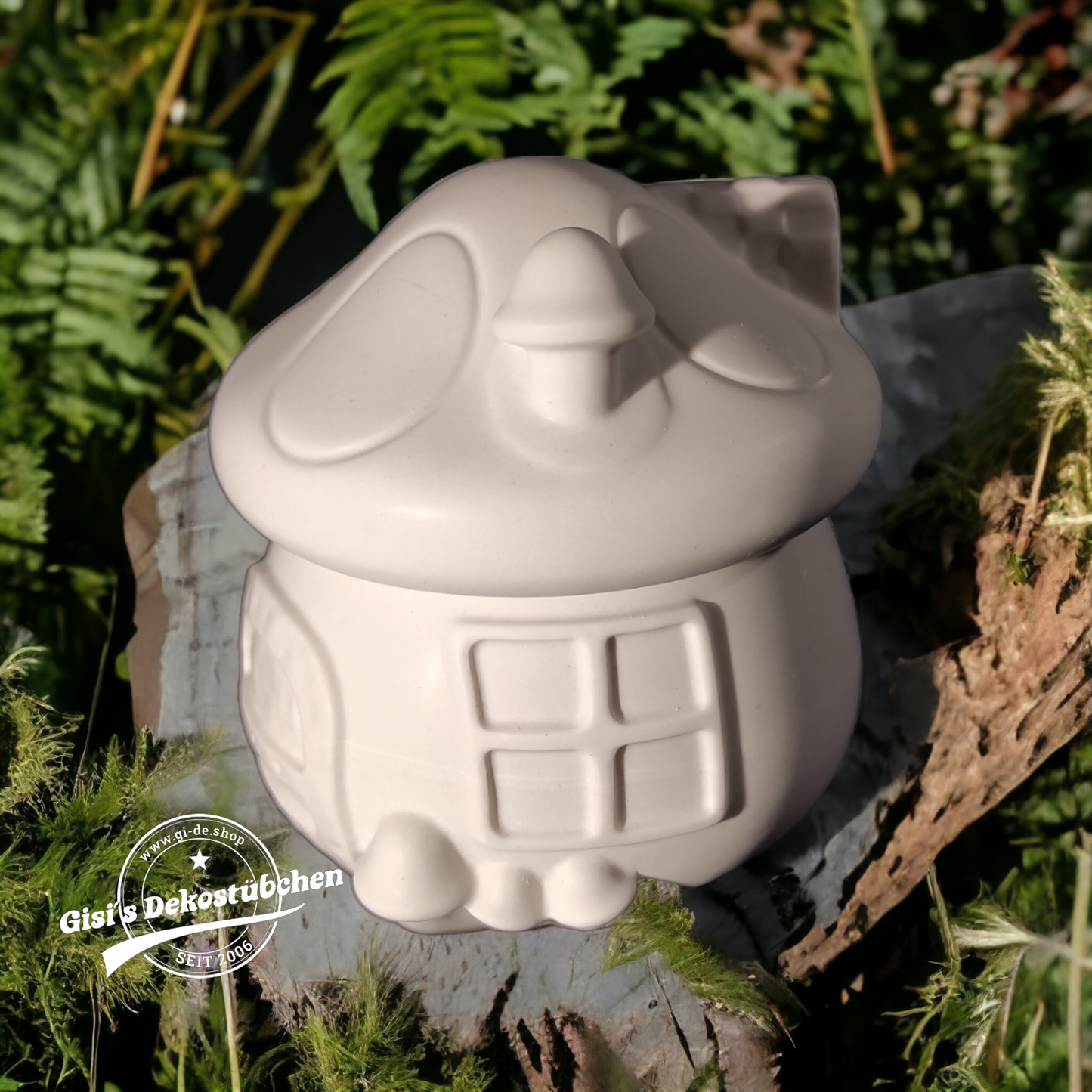 Cute ceramic mushroom in the shape of a box with a door and chimney.