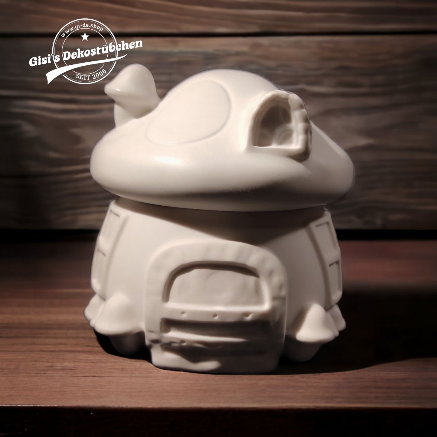 Cute ceramic mushroom in the shape of a box with a door and chimney.